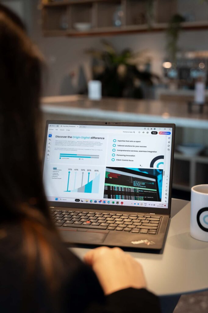 Woman on laptop creating user interface